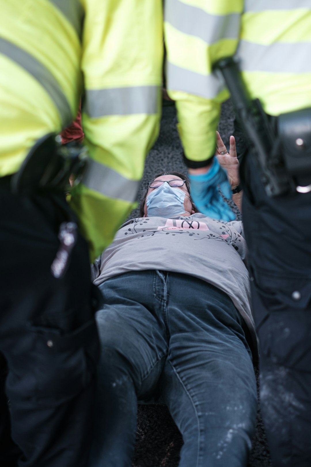 people in black jacket holding rifle