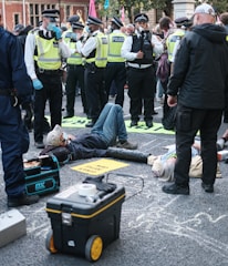 Close-up of police protective vests with badges visible.