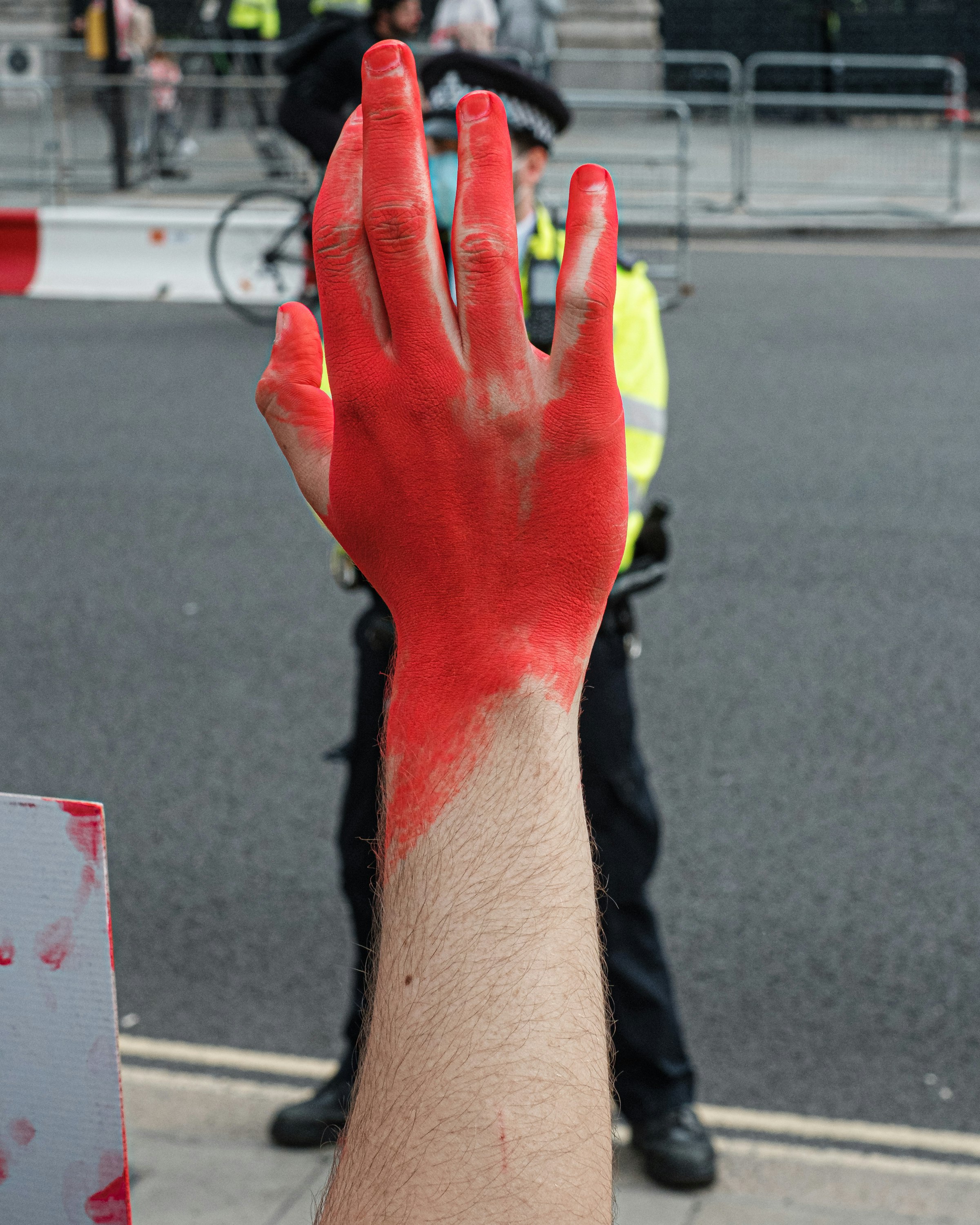 persons left hand with red manicure