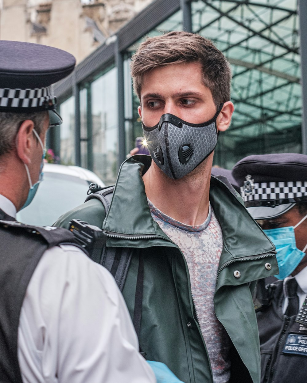 man in black leather jacket wearing black mask