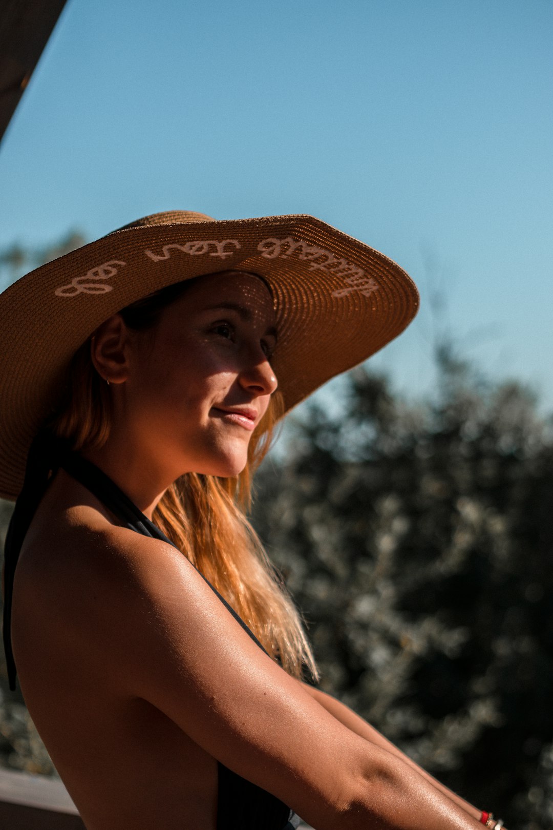 woman in brown sun hat