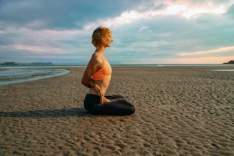 A peaceful beach scene with yoga mats set up for a session.