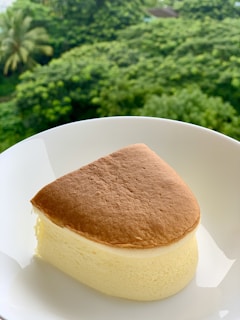 A 6-inch Japanese sponge cake slice showing its soft, airy texture with a subtle golden crust.