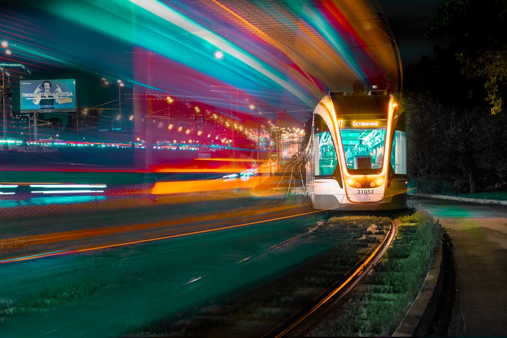 time lapse photography of vehicle lights on road during night time