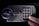 A hand presses the number 0 on an electronic keypad. The keypad is attached to a grey safe with a round handle and the words EASY HOME written above the keypad.