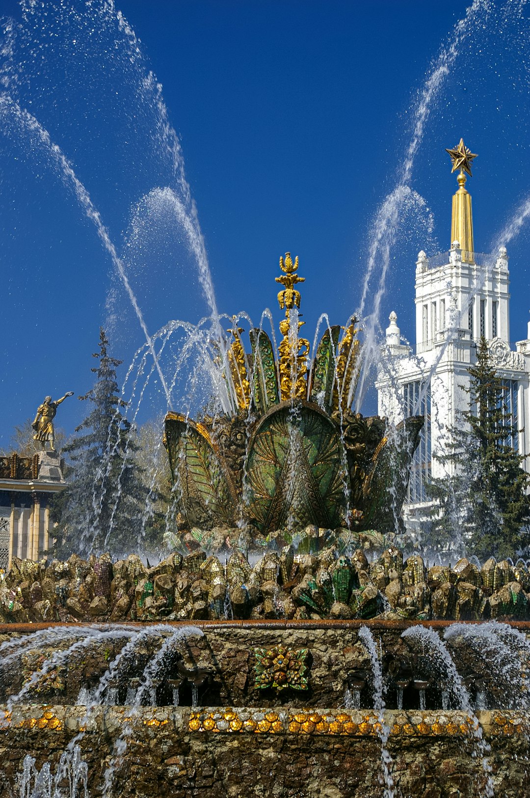 water fountain in front of white building