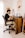a man sitting at a desk working on a laptop