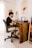 a man sitting at a desk working on a laptop