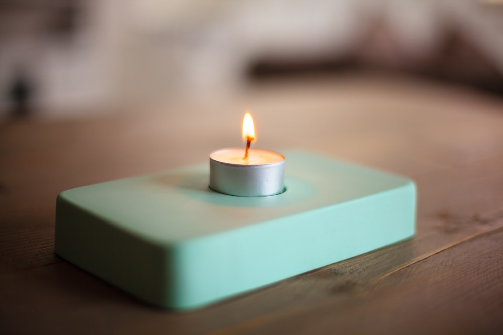 blue candle on blue table