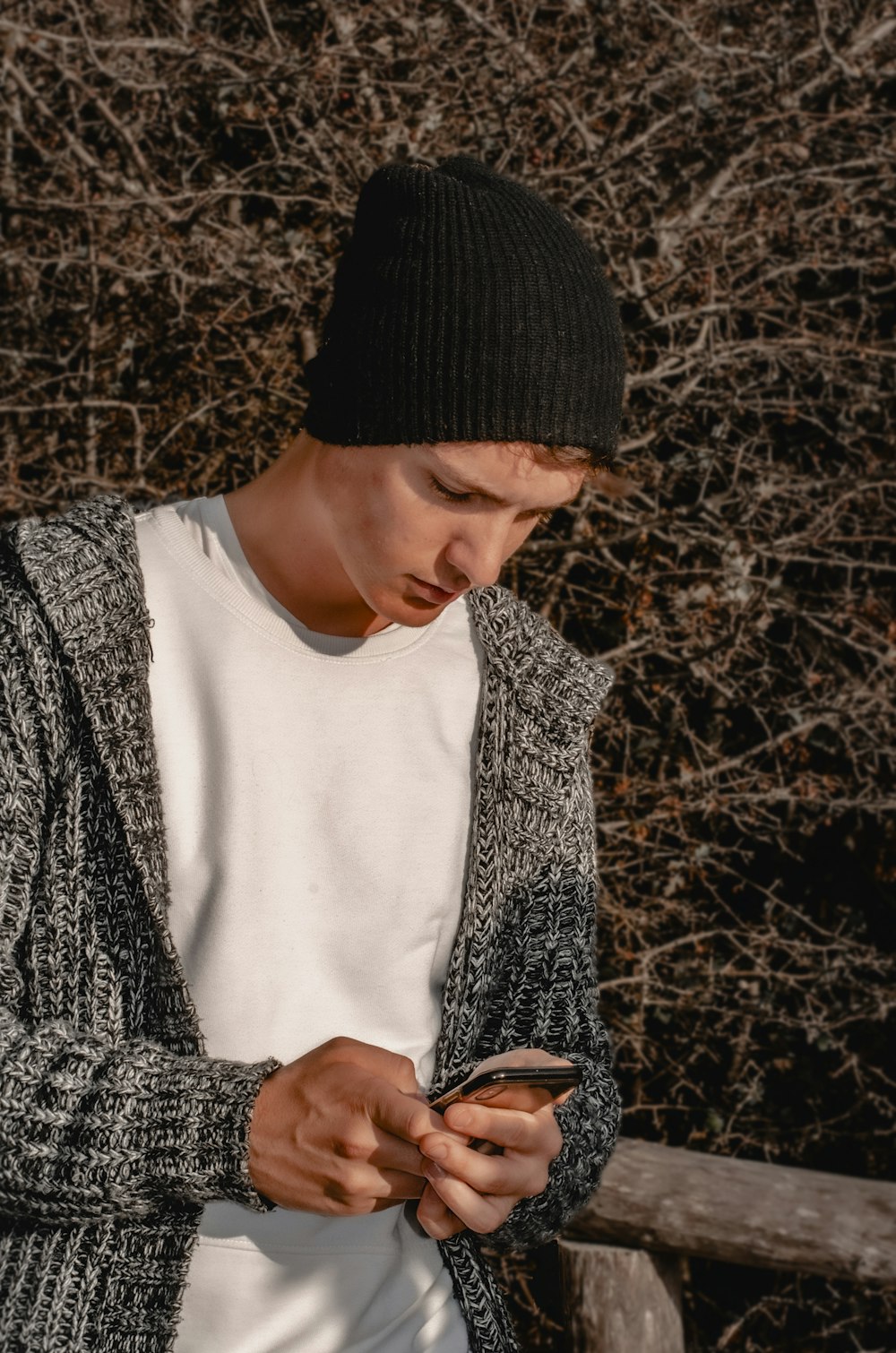 woman in black knit cap and white crew neck shirt