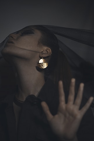 person wearing gold and silver ring