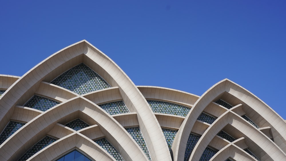 white concrete building under blue sky during daytime