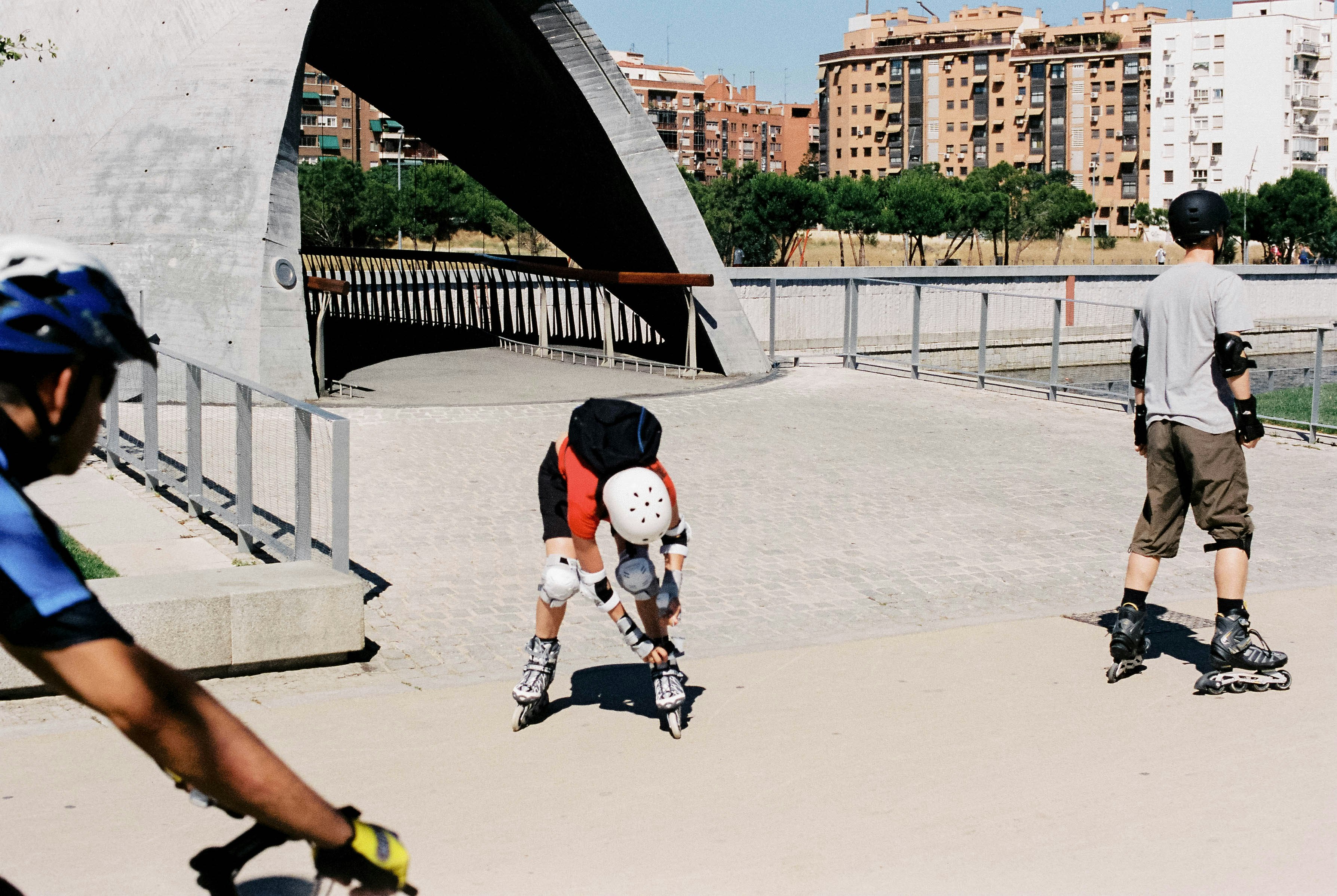 man in white t-shirt and black shorts playing soccer during daytime