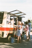An outdoor scene of happy customers enjoying ice cream.