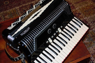 Close-up of sticky accordion keys being carefully cleaned and adjusted