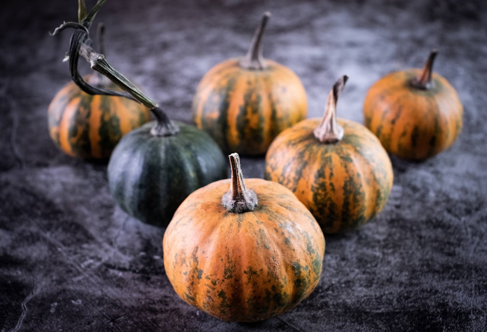 orange pumpkin on black textile