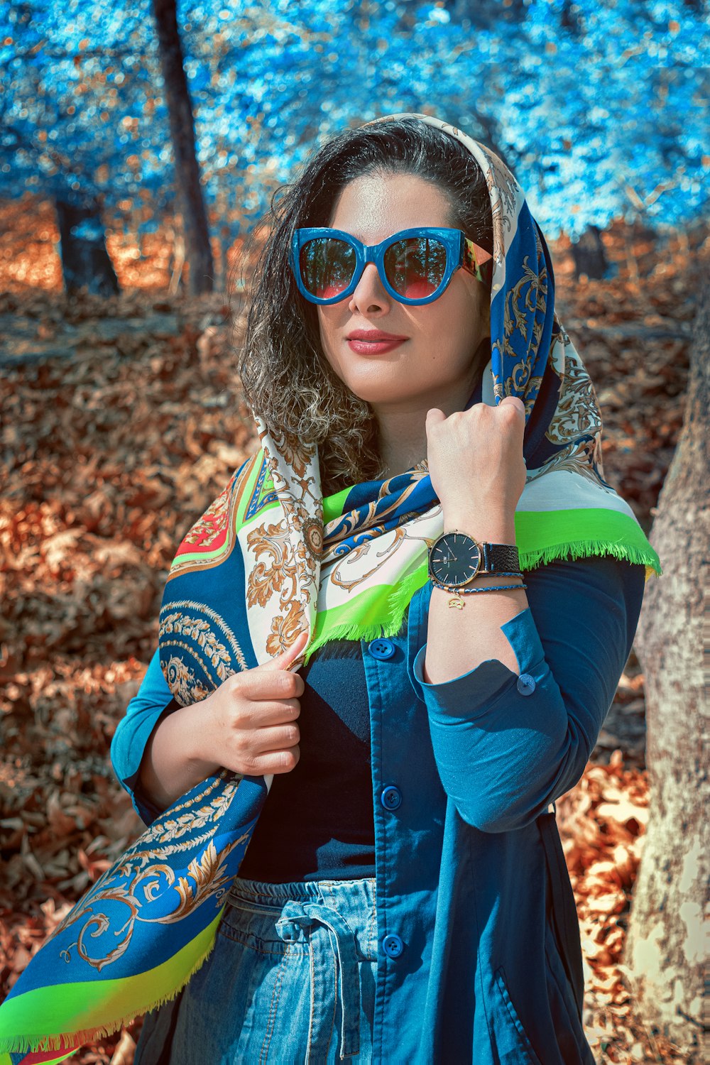 woman in blue jacket wearing sunglasses