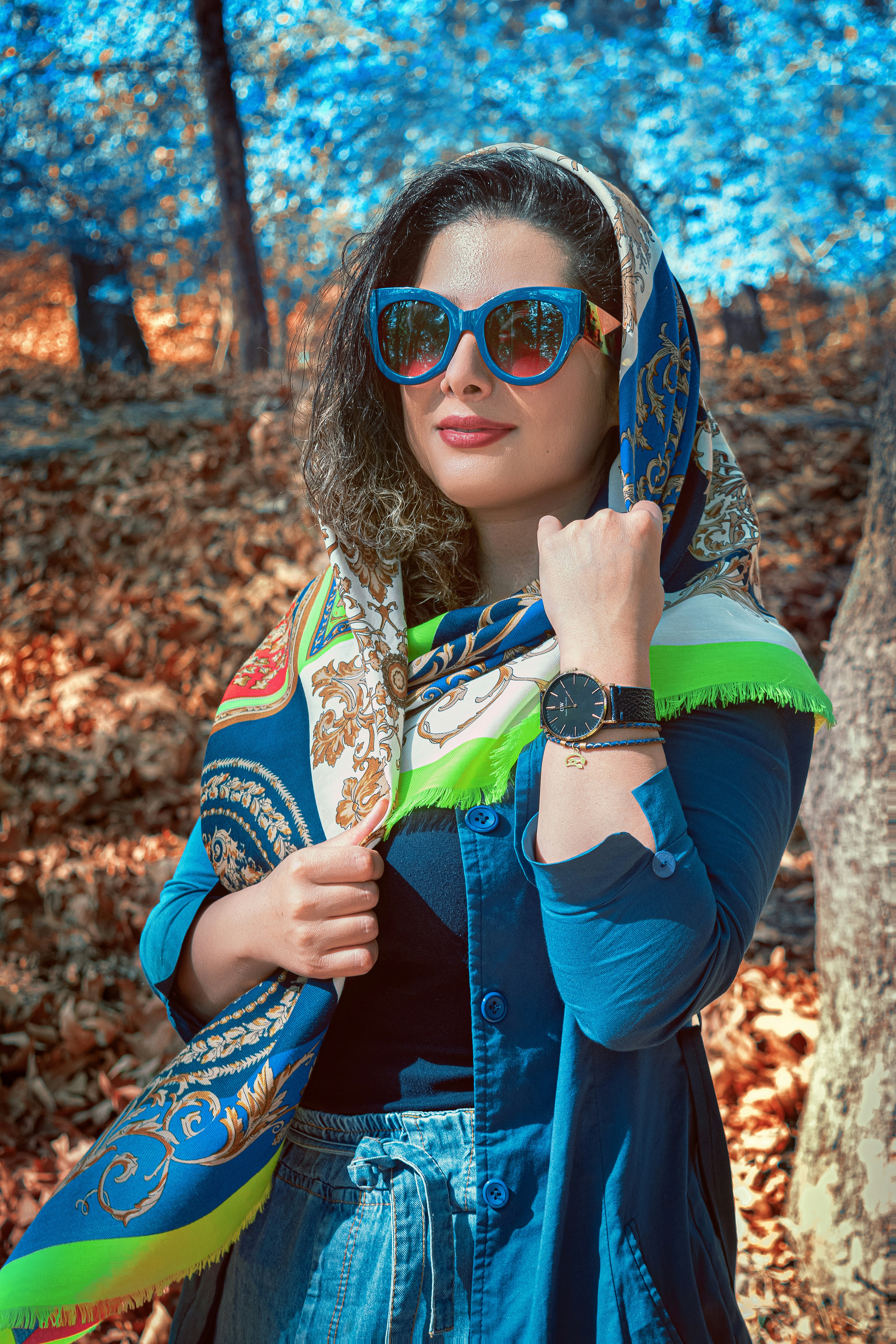 woman in blue jacket wearing sunglasses