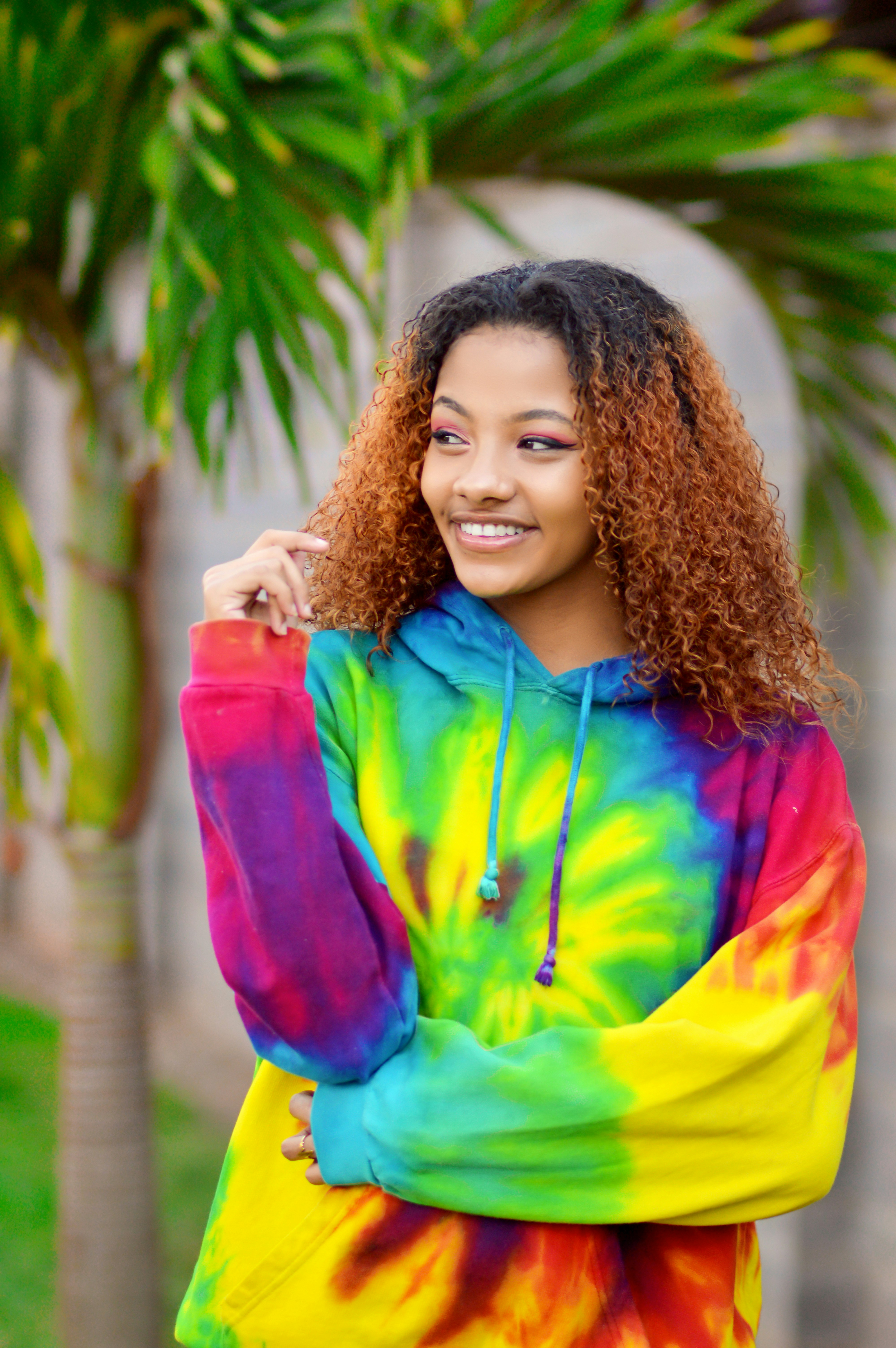 Woman in colorful tie-dye boxy tee casual summer look vibrant