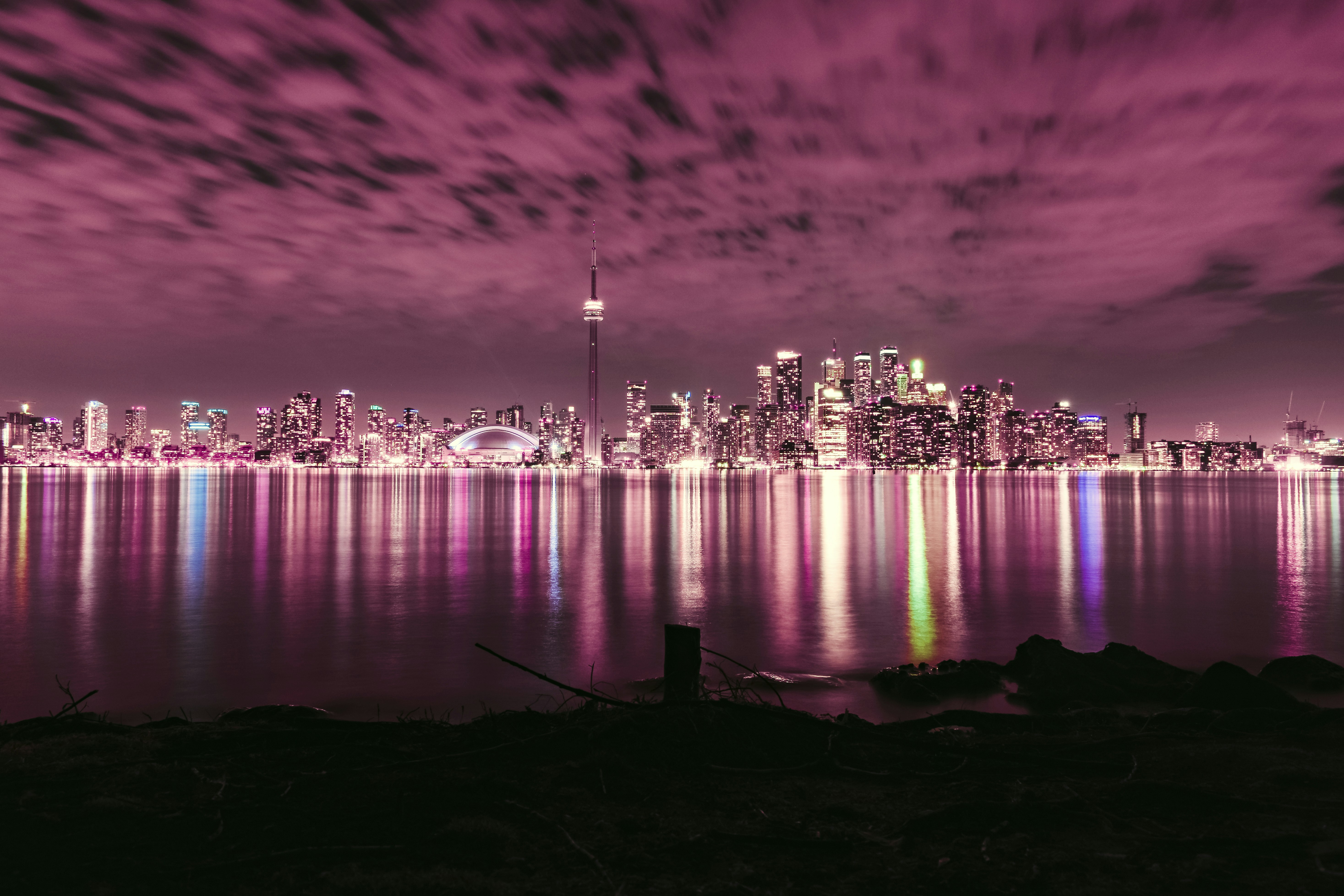 Toronto skyline across water at night
