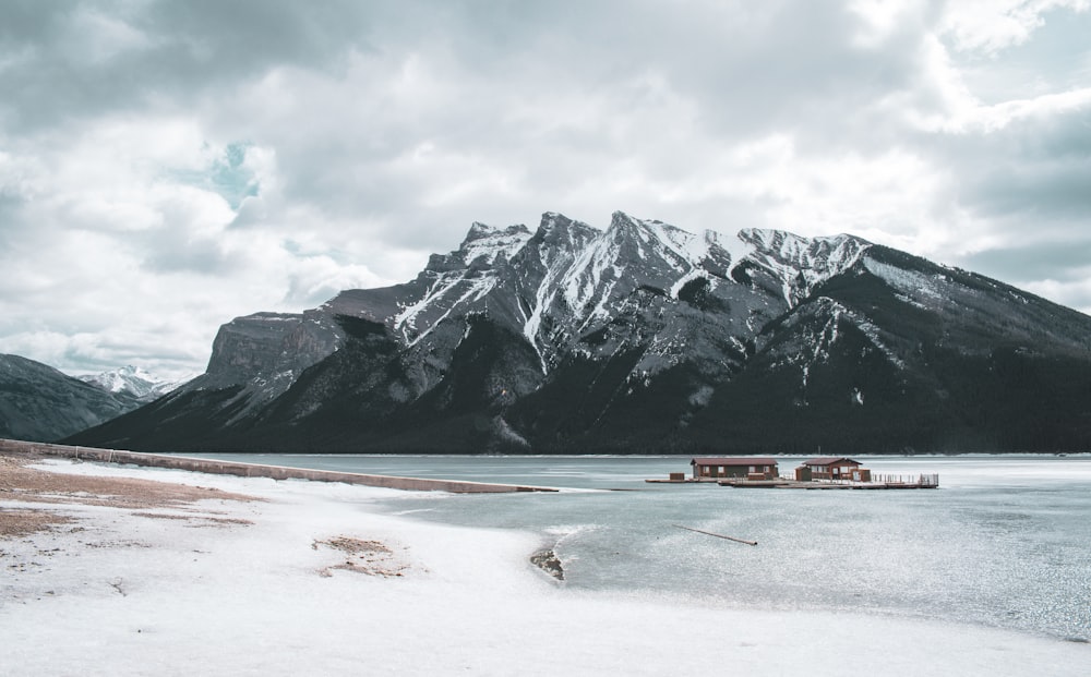 snow covered mountain under cloudy sky during daytime