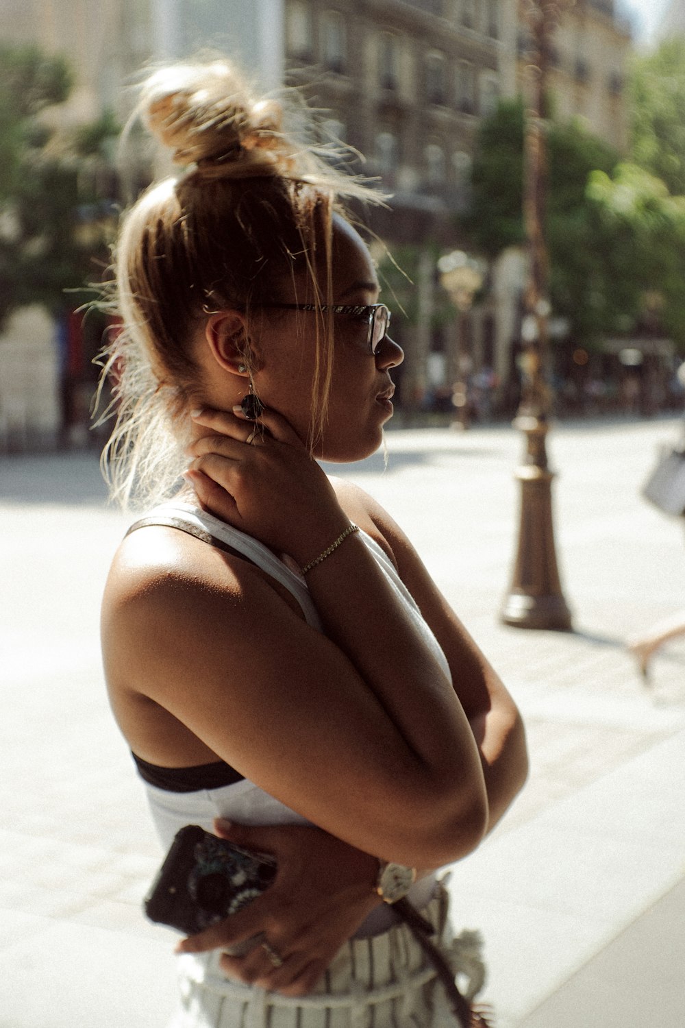 woman in black tank top wearing eyeglasses