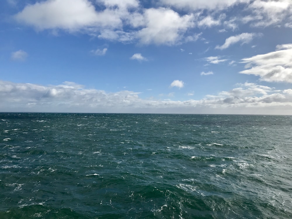 blue sky and white clouds over sea