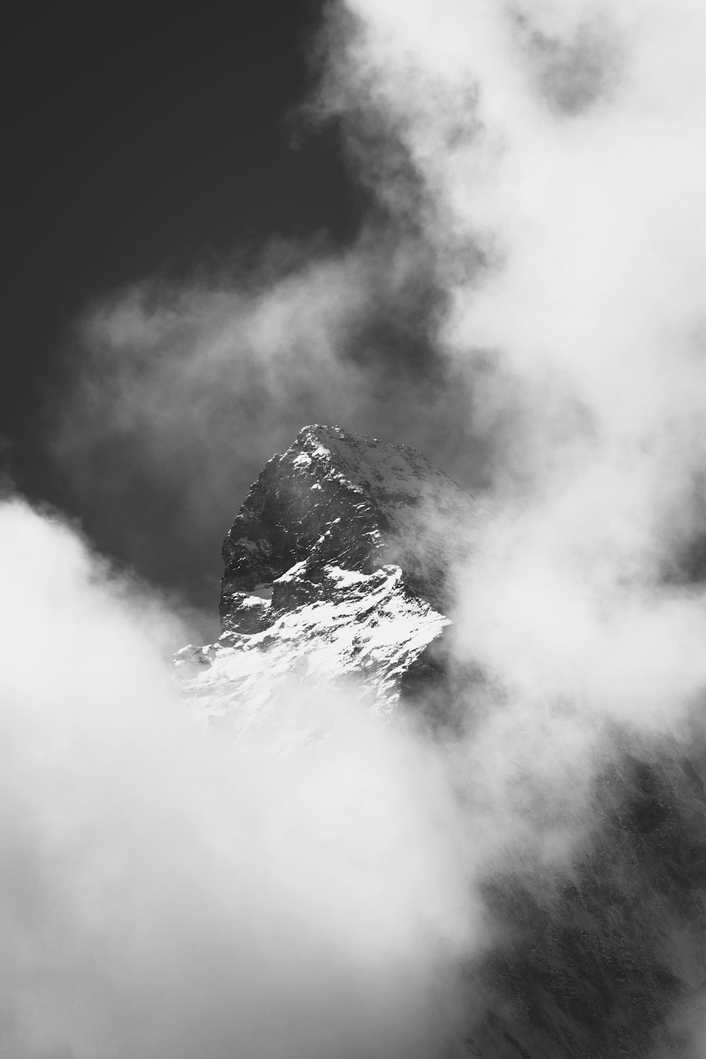 grayscale photo of mountain covered by snow