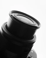 Close-up of a sleek camera lens showcasing intricate details.