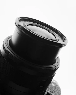 Close-up of a sleek camera lens showcasing intricate details.