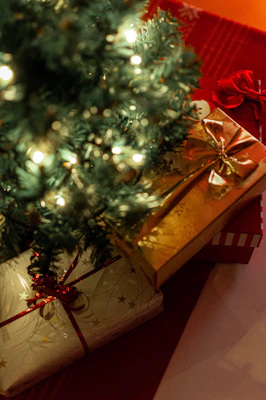 Gift wrapping materials including paper, scissors, and ribbon