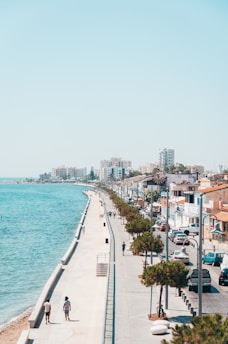 city buildings near body of water during daytime