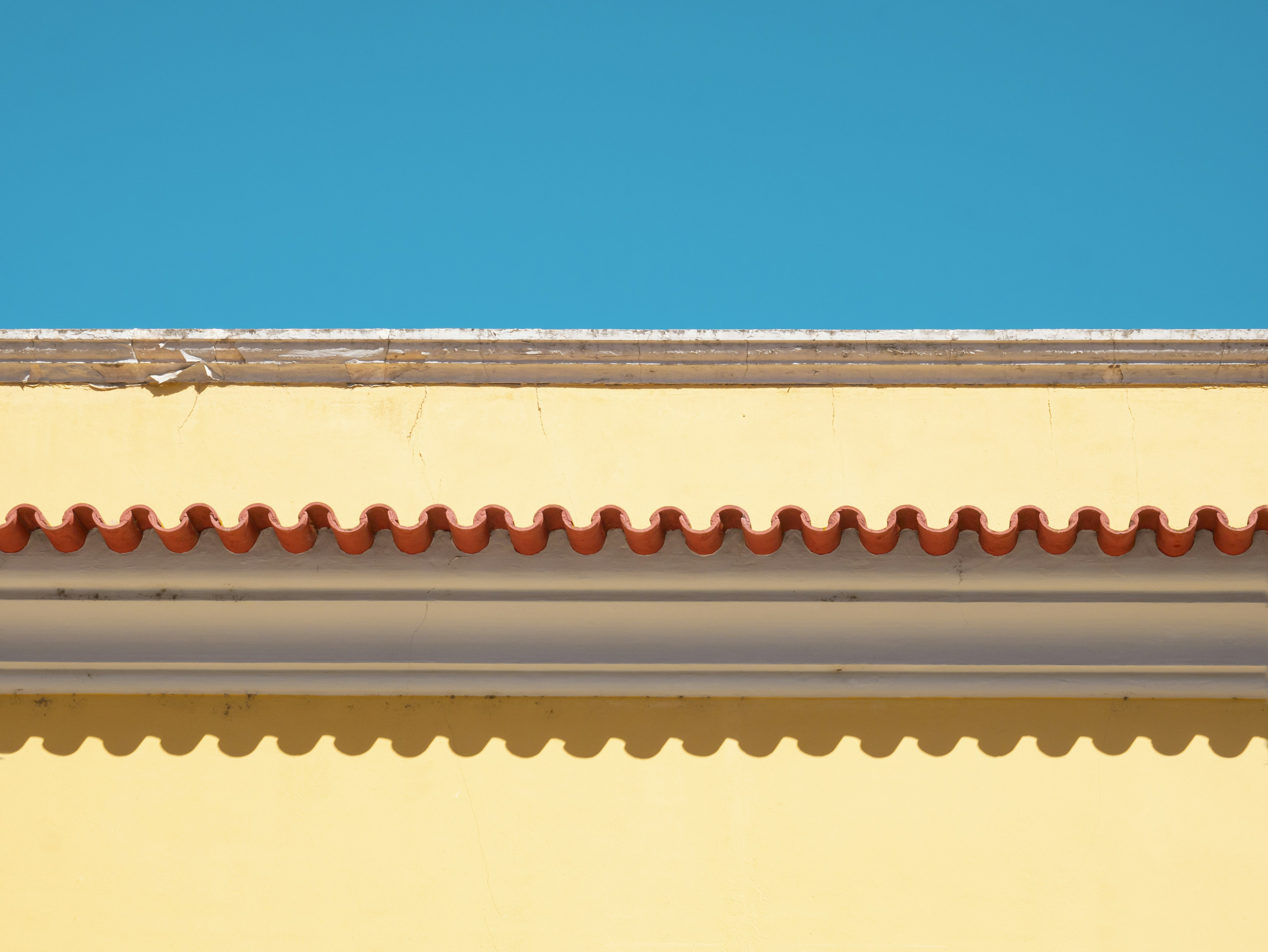 white concrete wall under blue sky during daytime, 