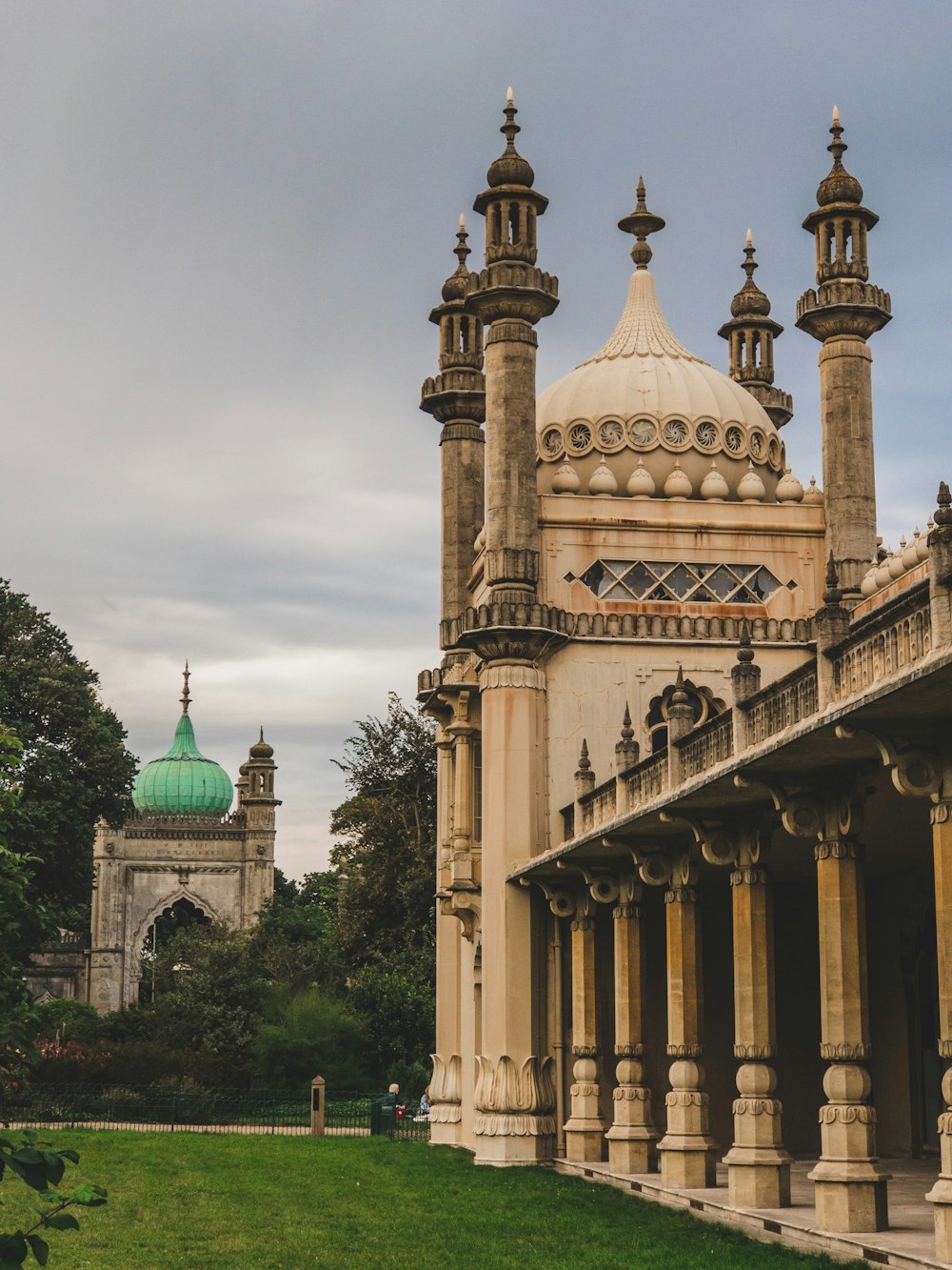 a large building with a green dome on top of it