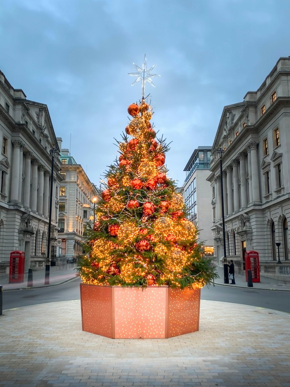 green and red christmas tree on gray concrete floor