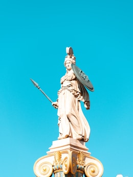 man holding a sword statue