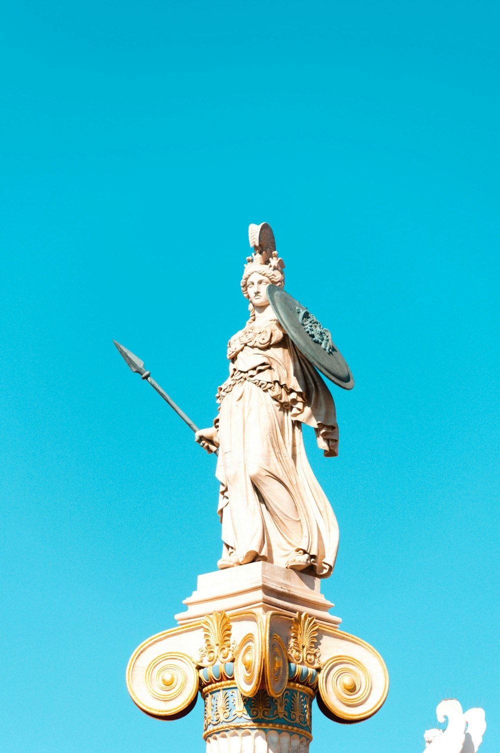 man holding a sword statue