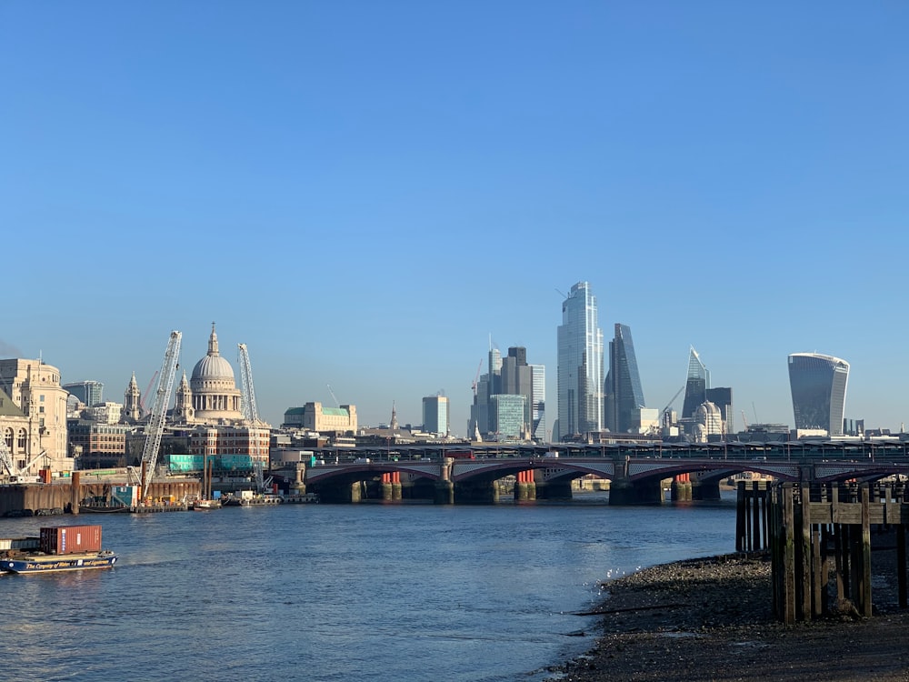 city skyline across body of water during daytime