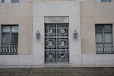 black metal window frame on brown concrete wall