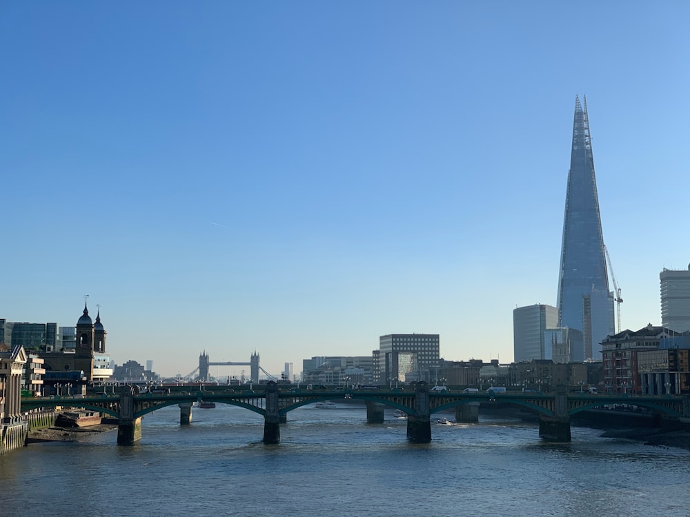 gray concrete bridge over river during daytime