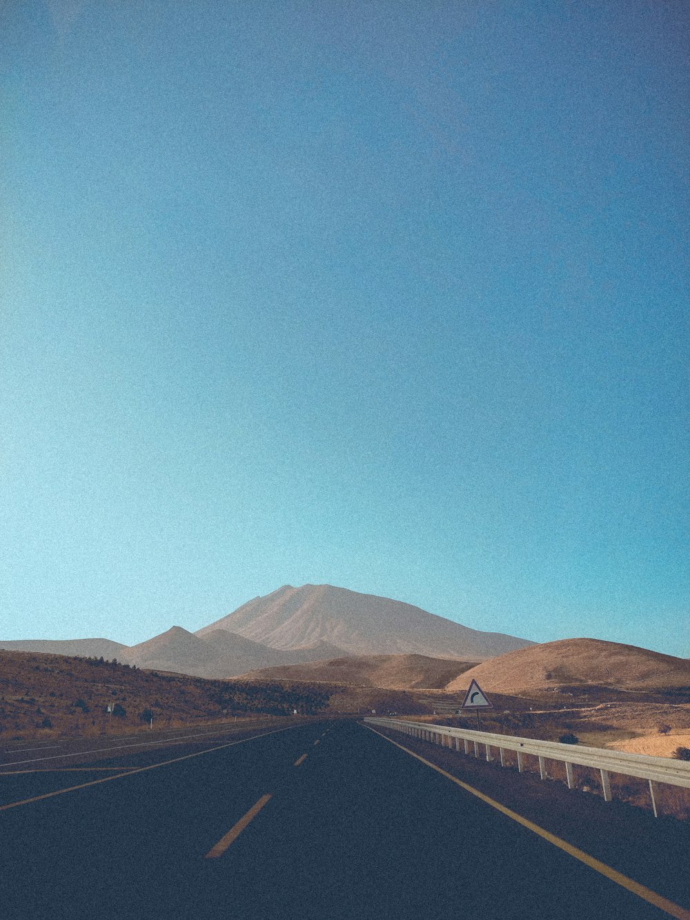 brown mountain under blue sky during daytime