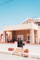brown and white concrete building under blue sky during daytime