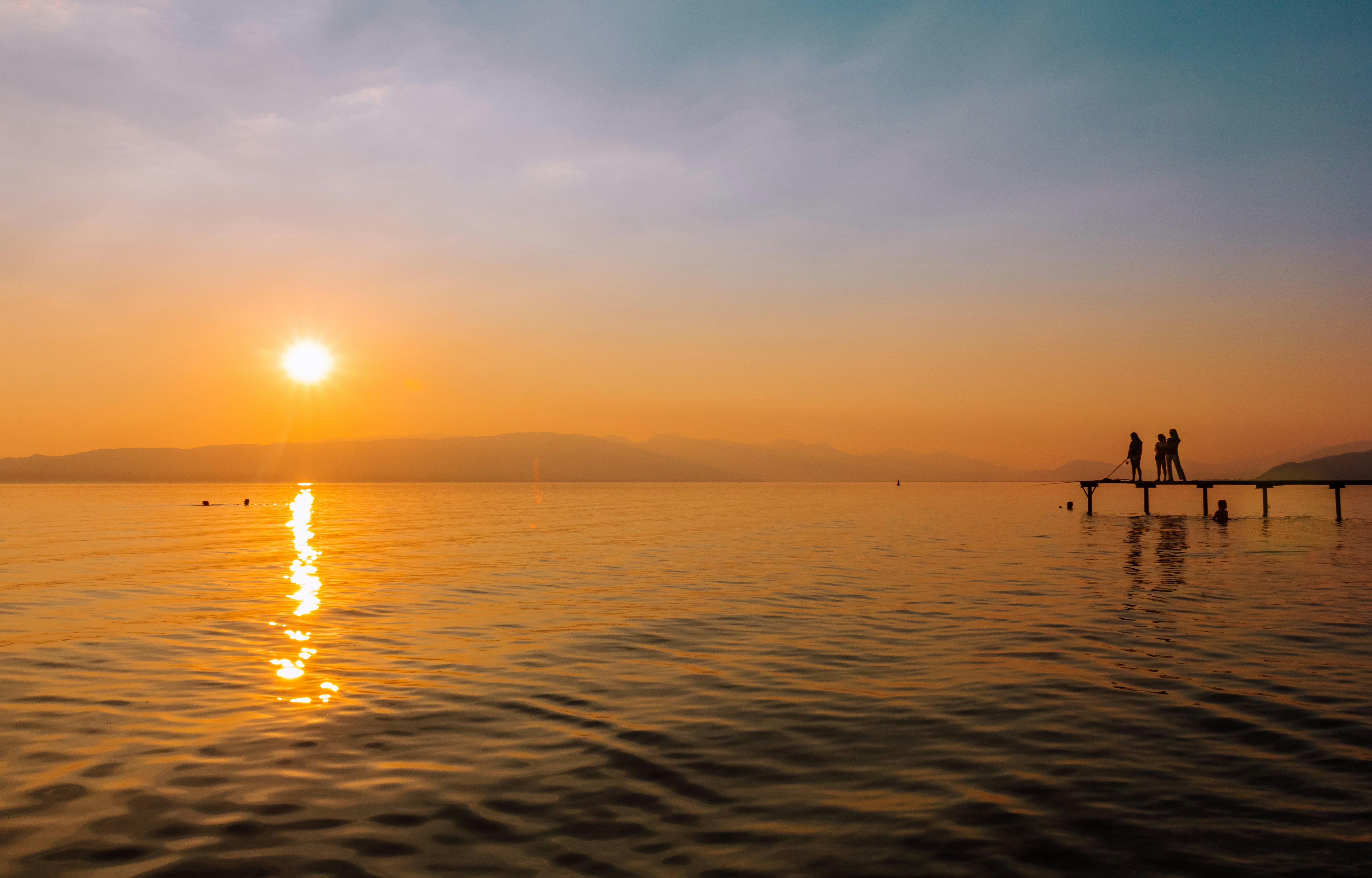 body of water during sunset