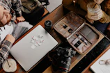 A workspace featuring various computer accessories and cartridges ready for refilling.