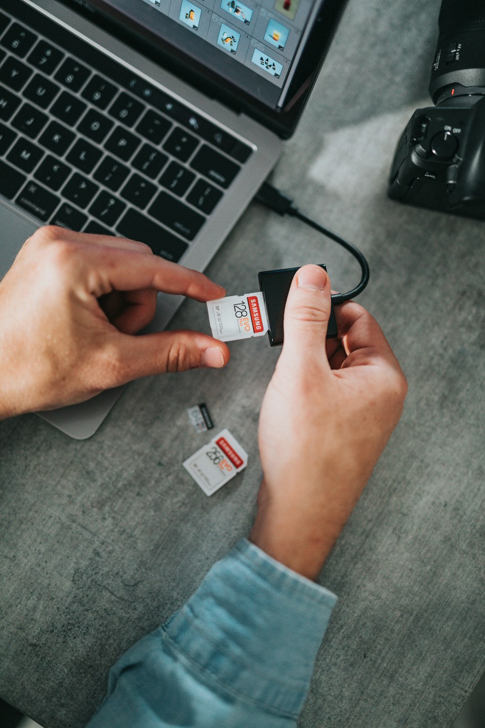 person holding white and black card