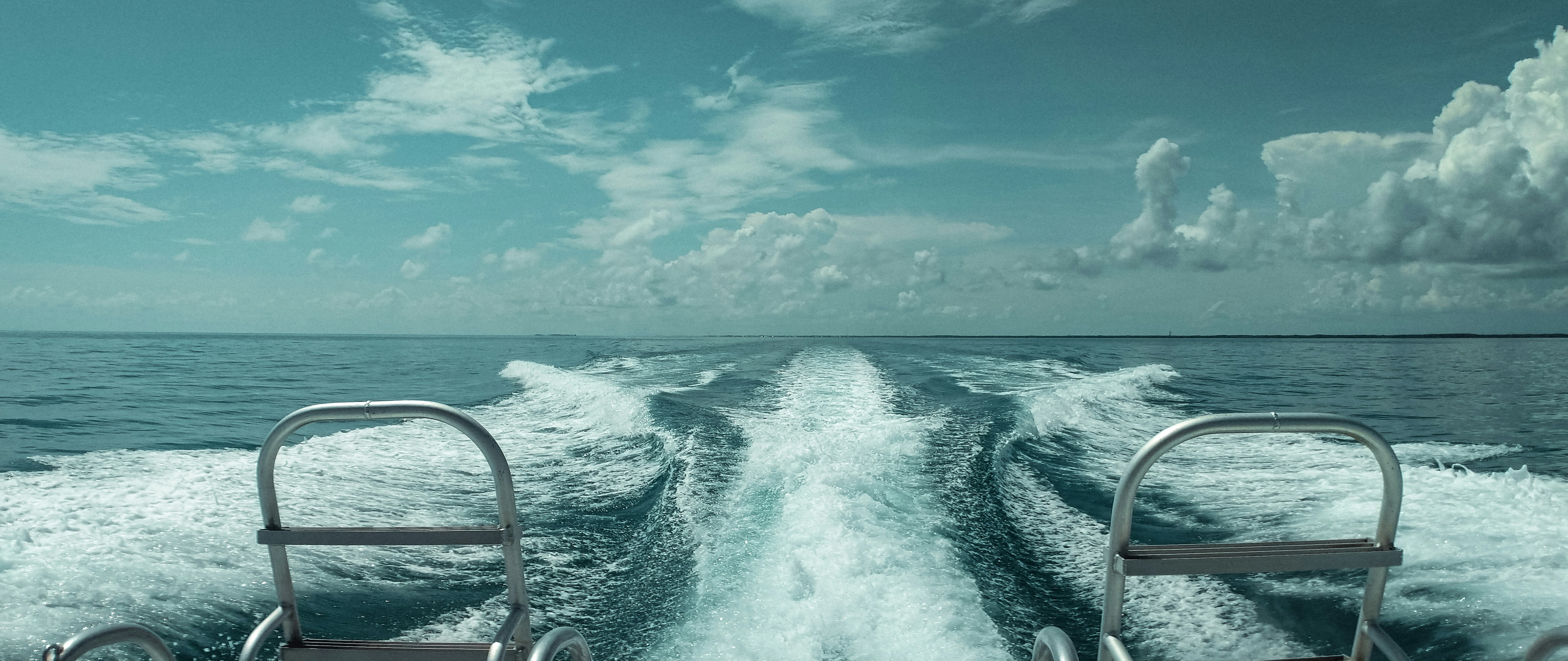 ocean waves crashing on shore during daytime