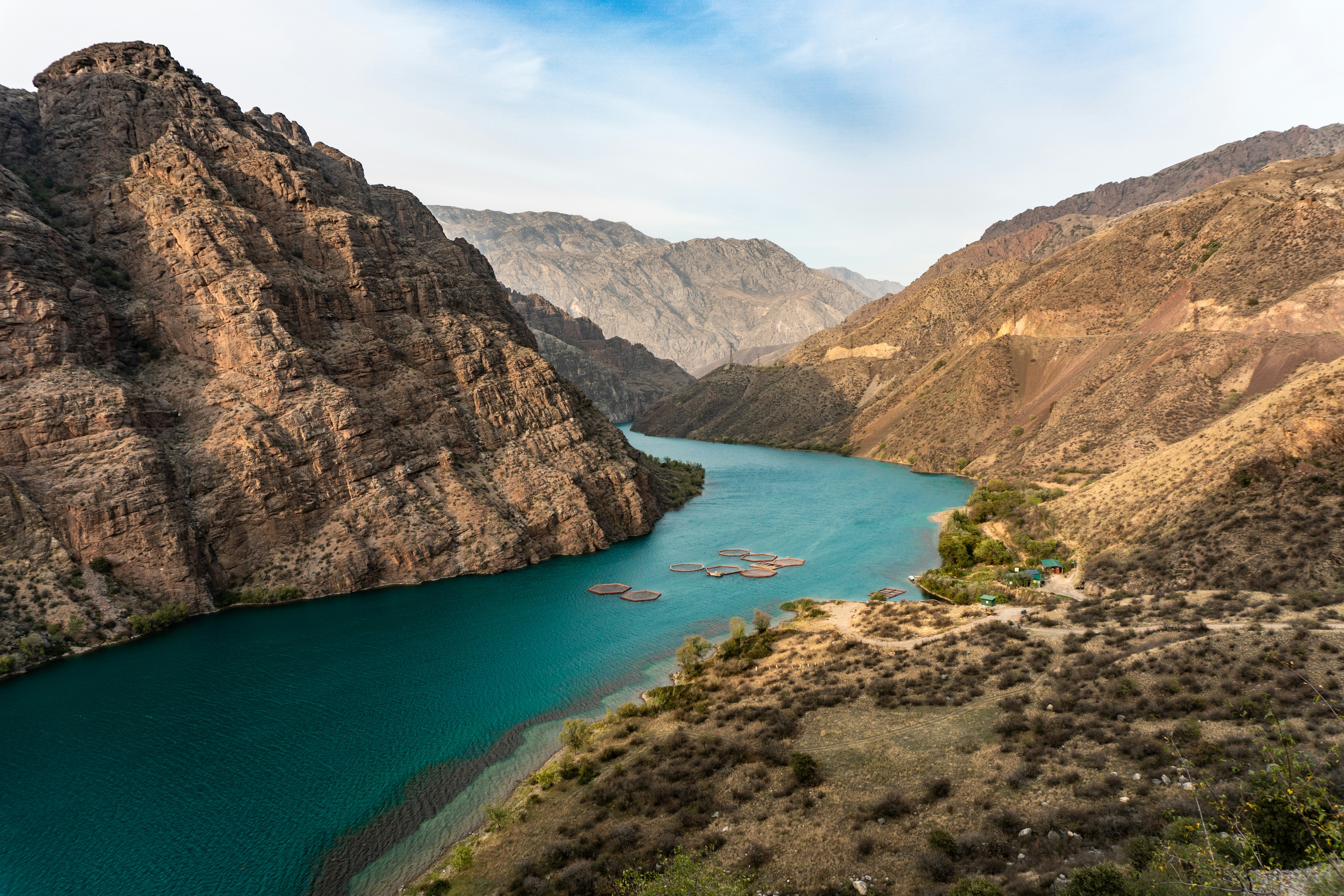 brown rocky mountain beside blue lake under blue sky during daytime, Naryn River, Kyrgyzstan 
