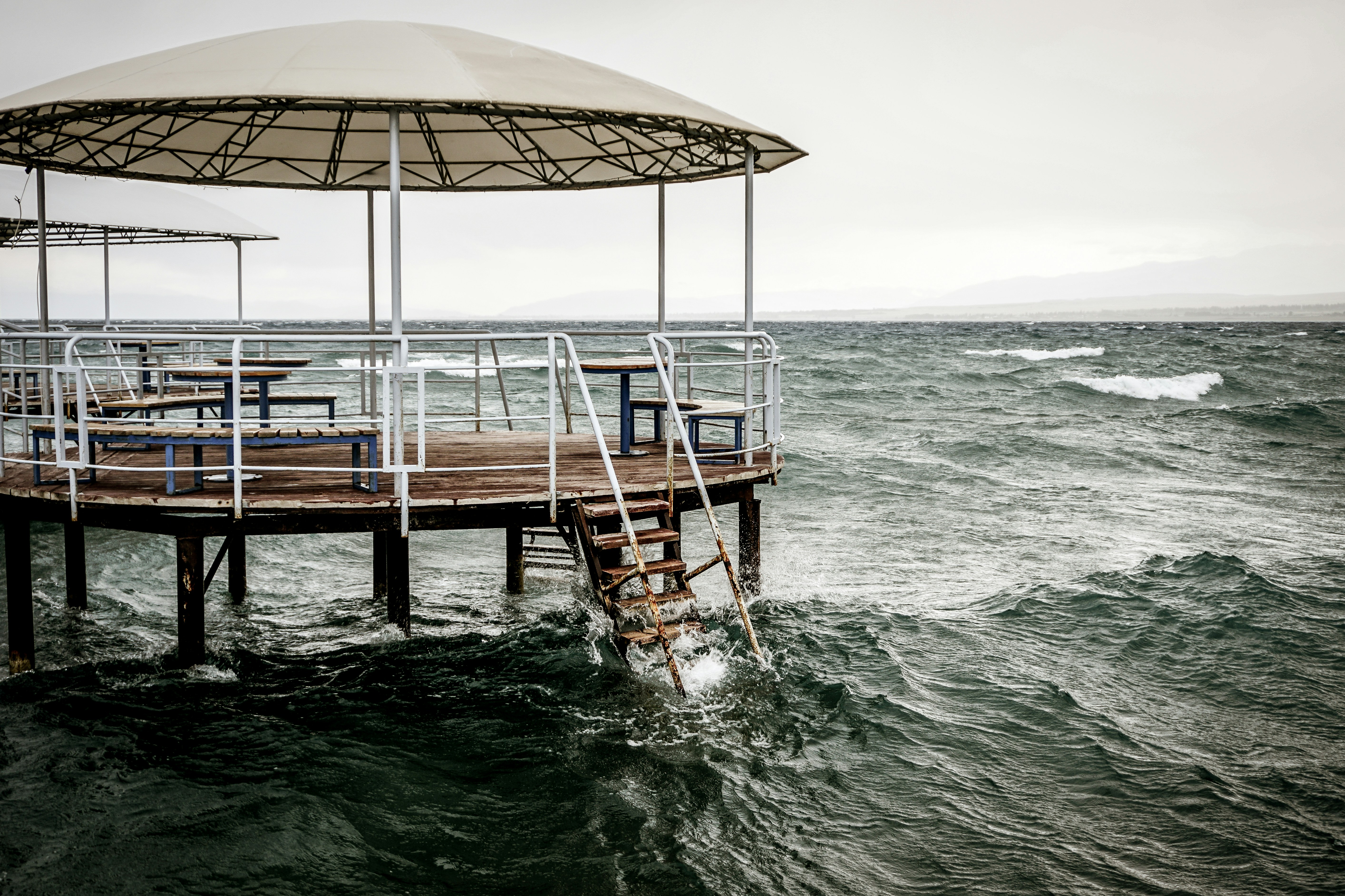 brown wooden dock on sea during daytime kyrgyzstan zoom background