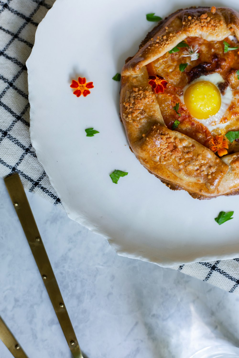 pizza on white floral round plate