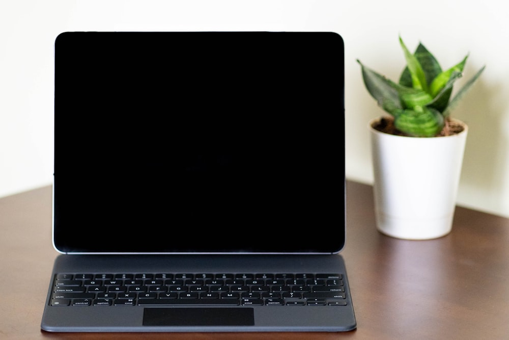 black and silver laptop computer